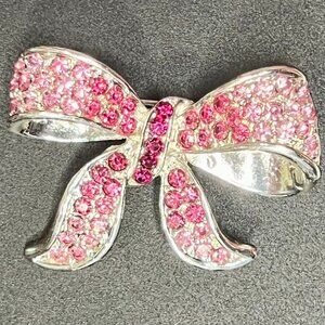 30 - May 11 - Silvertone Pink Rhinestone ribbon brooch, PD mark, 2 x 1.5”